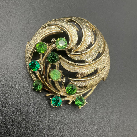 Vintage Gold Tone Green Rhinestone UV Reactive Fluorescent Swirl Brooch