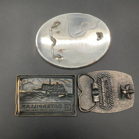 Vintage Lot 3 Belt Buckles Montana Silversmiths Caterpillar Inland Truck Parts