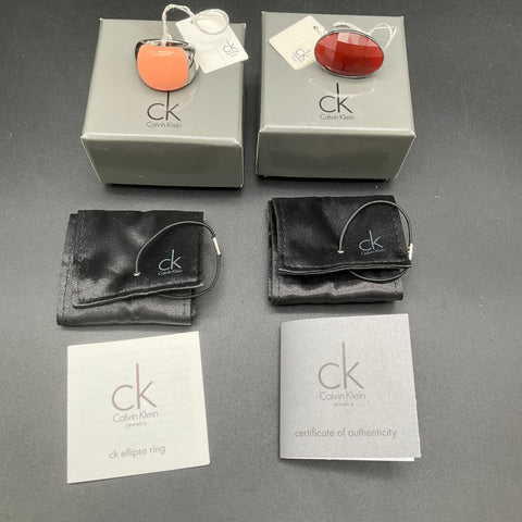 Calvin Klein Ring Lot 2 Pieces Size 7 NWT Ellipse Red Stone COA Boxes