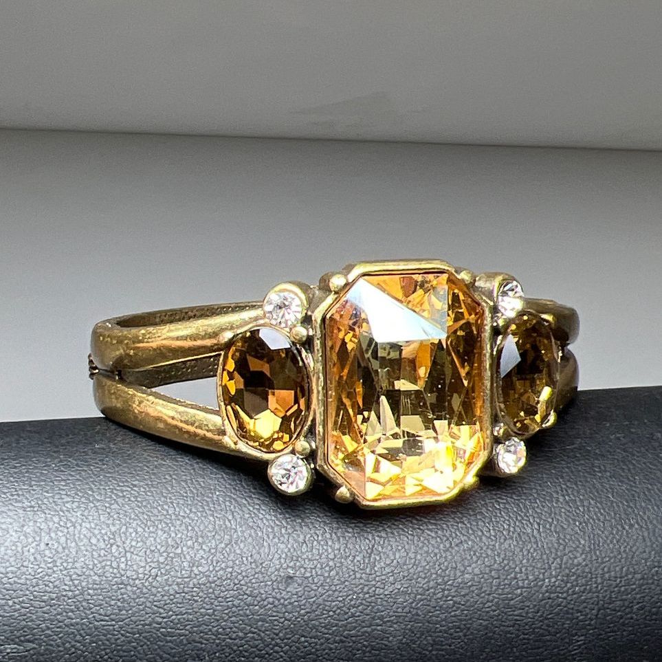 Multifaceted Rhinestone Gold Tone Hinged Bangle Bracelet