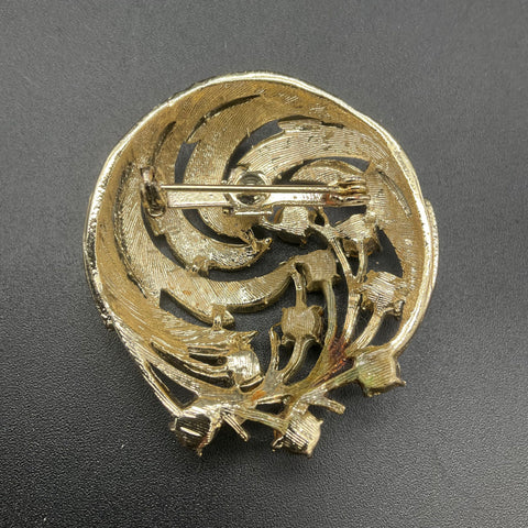 Vintage Gold Tone Green Rhinestone UV Reactive Fluorescent Swirl Brooch