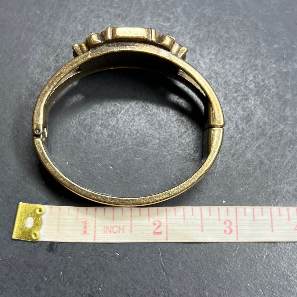 Multifaceted Rhinestone Gold Tone Hinged Bangle Bracelet