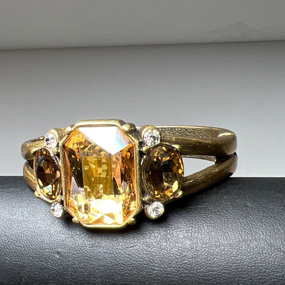 Multifaceted Rhinestone Gold Tone Hinged Bangle Bracelet