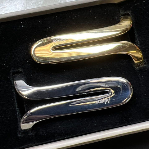 Athene Gold and Silver tone Thumb Braces in Box