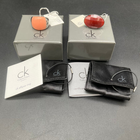 Calvin Klein Ring Lot 2 Pieces Size 7 NWT Ellipse Red Stone COA Boxes